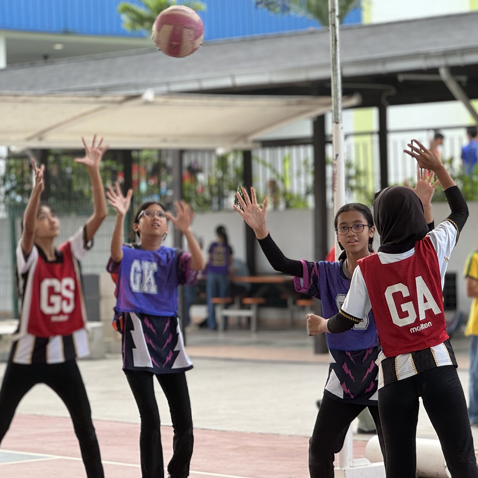 Students playing sports at the Asia Pacific School campus