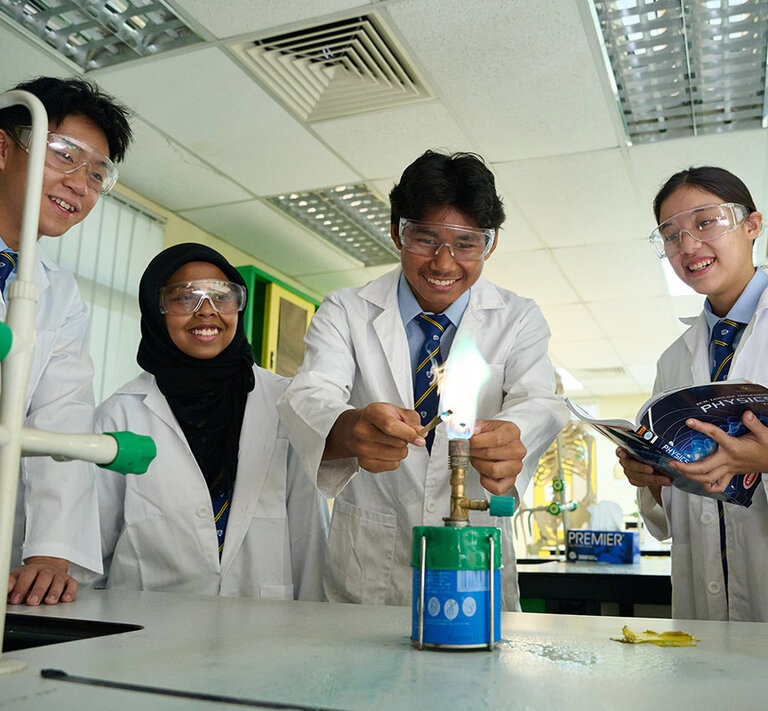 Students having fun while doing an experiment in a laboratory