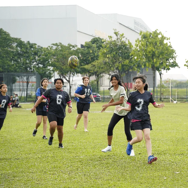 Students-playing-rugby-outside
