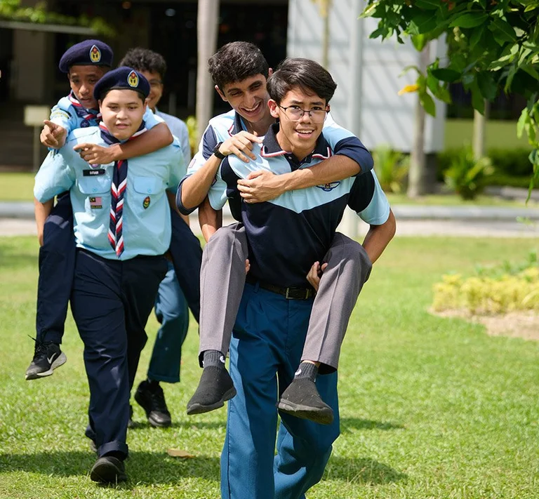 Teenagers piggyback running