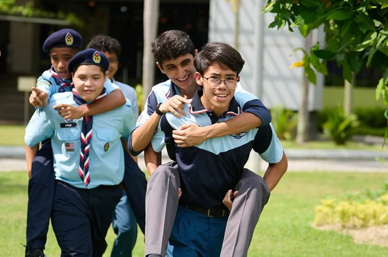 Teenagers piggyback running
