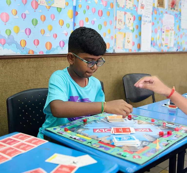 Kid playing board games