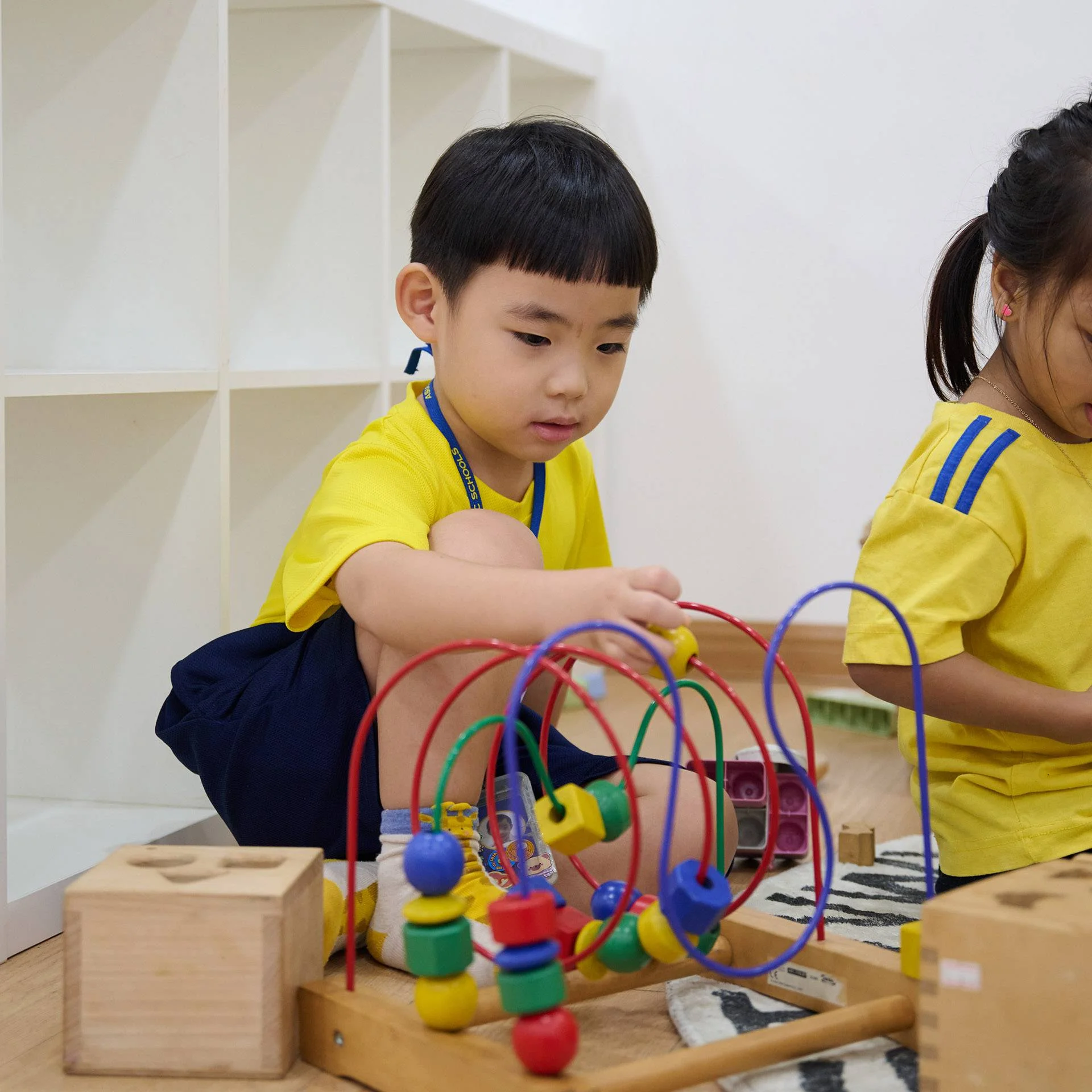 Child playing with educational toys