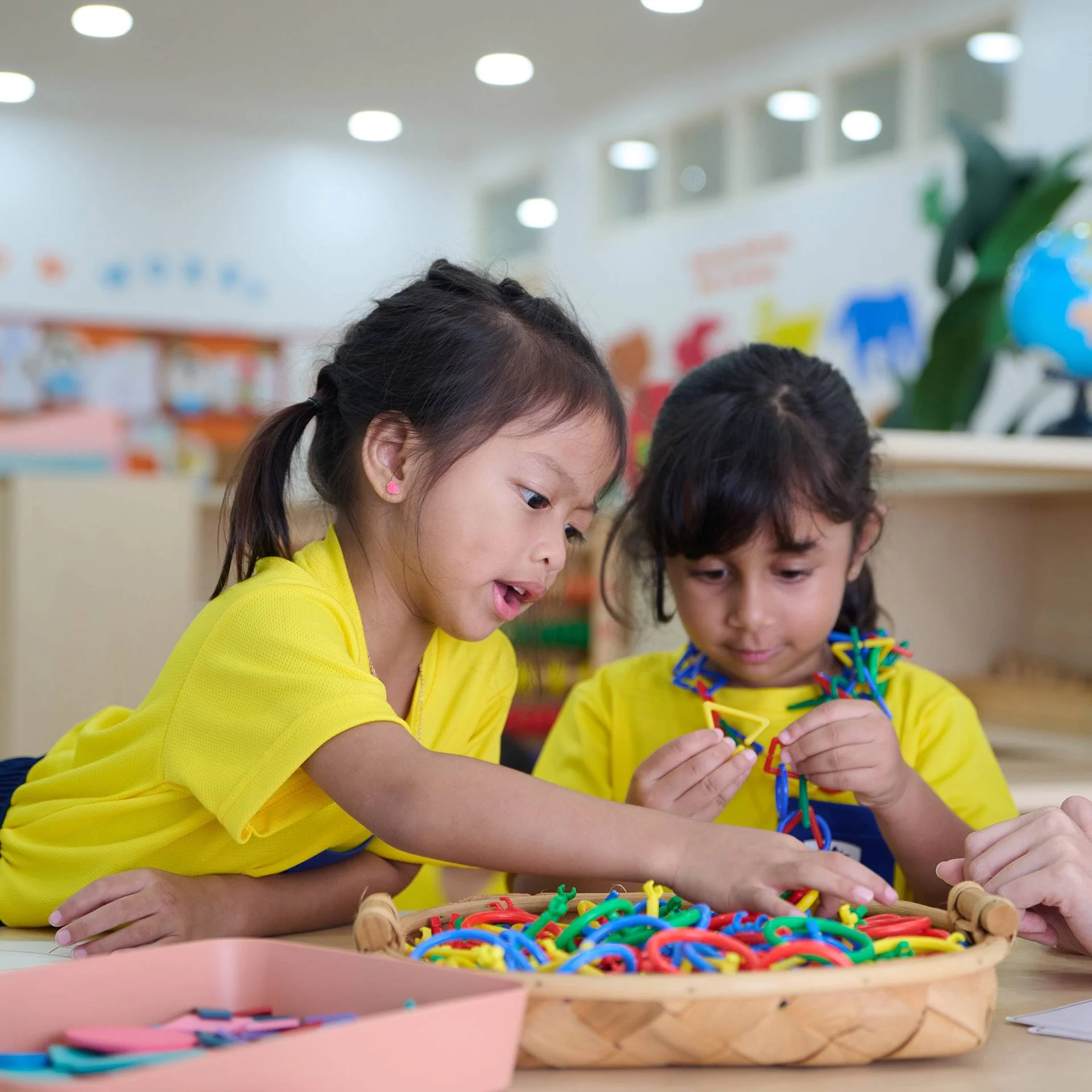 Preschool students playing with toys