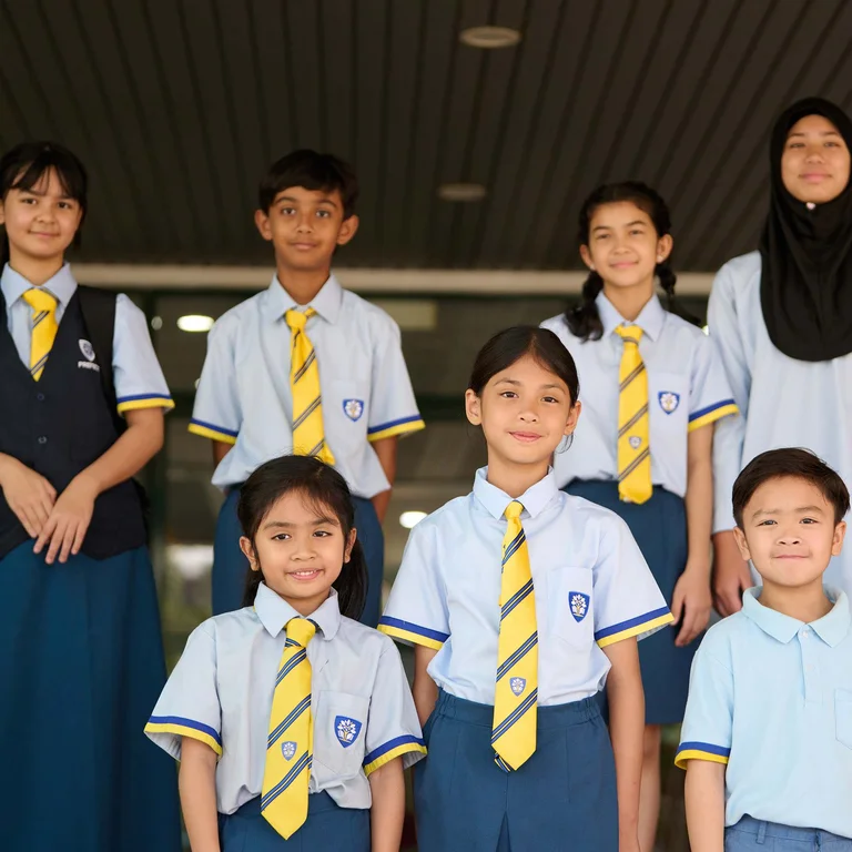 Primary school students posing for a picture
