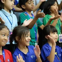 Kids laughing and moving their hands