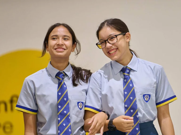 APS students holding their arms