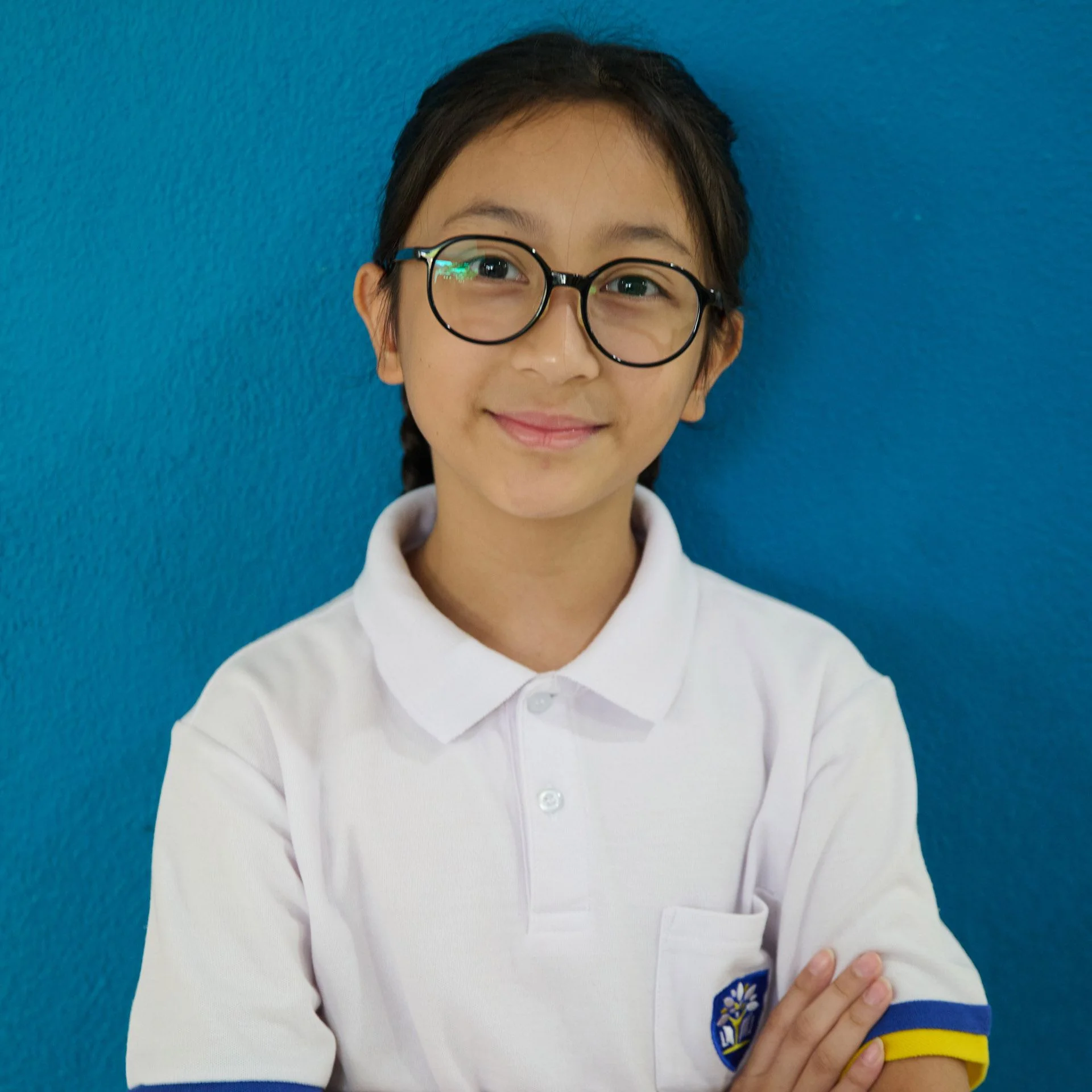 APS student smiling while posing for a picture