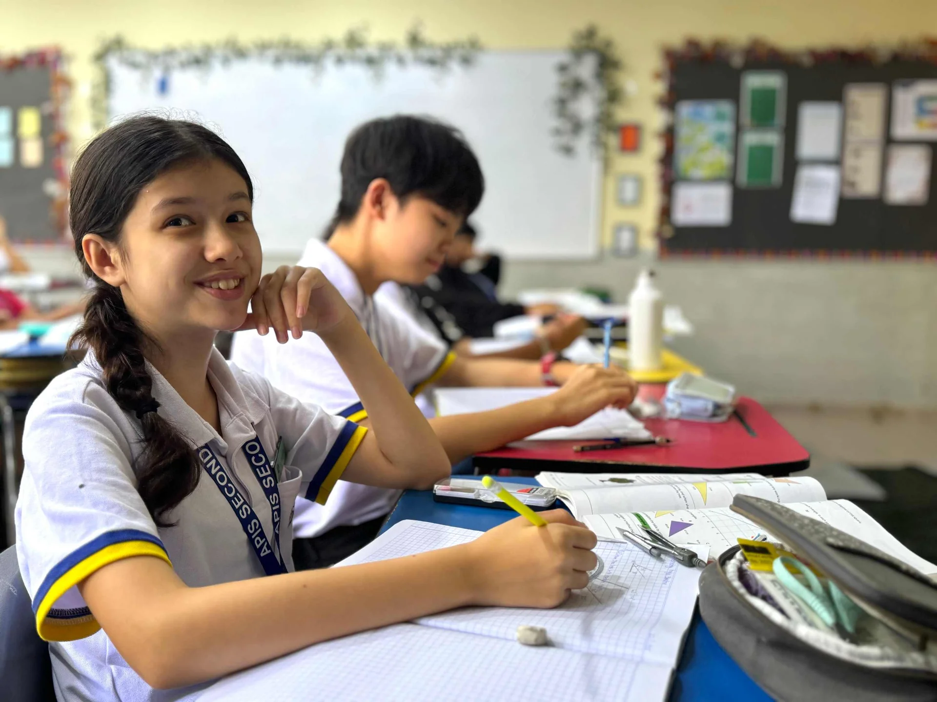 Middle schools students taking notes